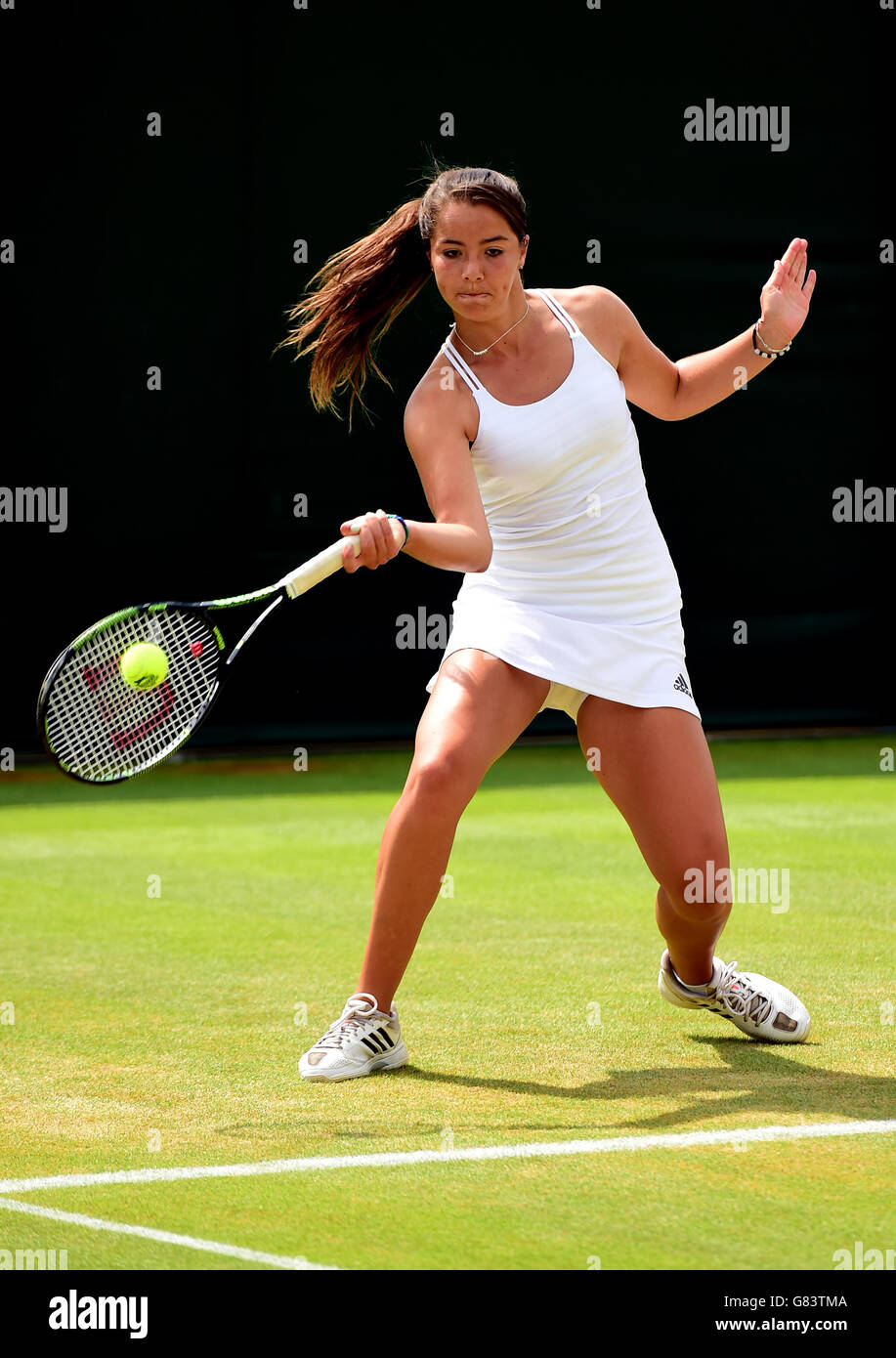 Jodie Anna Burrage competes in the girls singles on day Seven of the Wimbledon Championships at the All England Lawn Tennis and Croquet Club, Wimbledon. Stock Photo