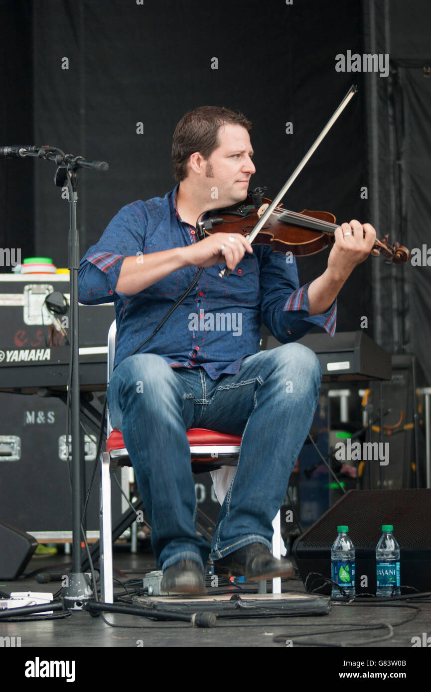 Andre Brunet, Quebecois musician playing  fiddle/foot tapping for De Temps Antan performing at the 2015 American Folk Festival Stock Photo
