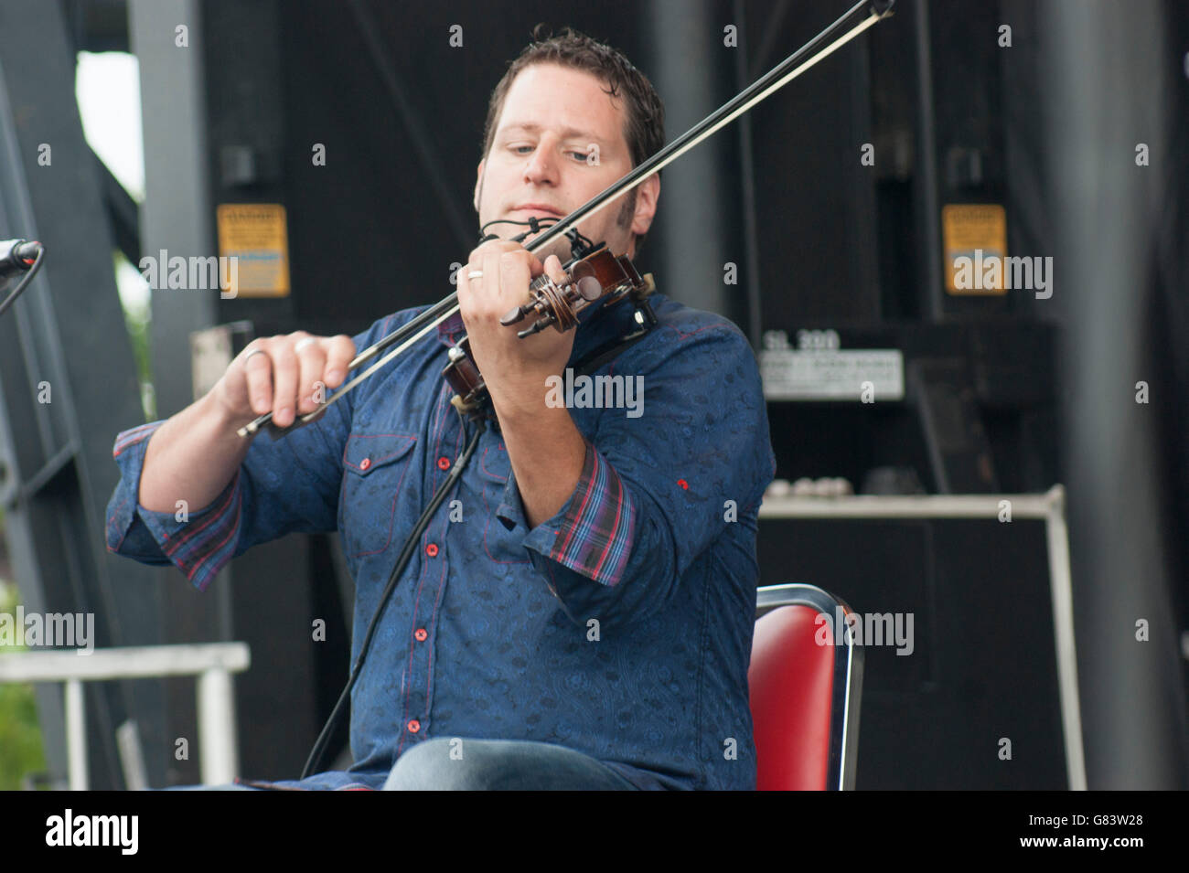 Andre Brunet, Quebecois musician playing  fiddle/foot tapping for De Temps Antan performing at the 2015 American Folk Festival Stock Photo