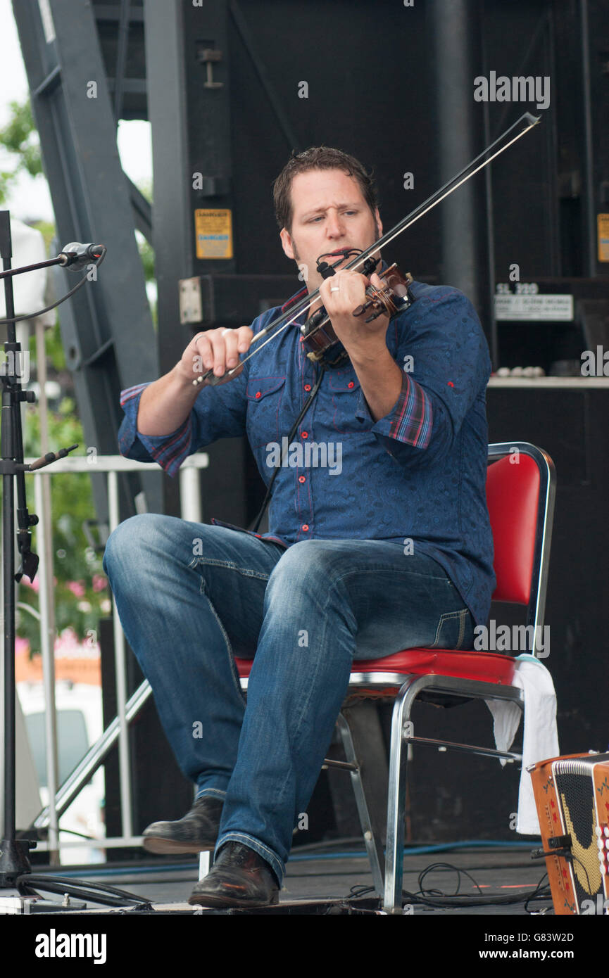 Andre Brunet, Quebecois musician playing the fiddle/foot tapping, De Temps Antan performing at the 2015 American Folk Festival Stock Photo