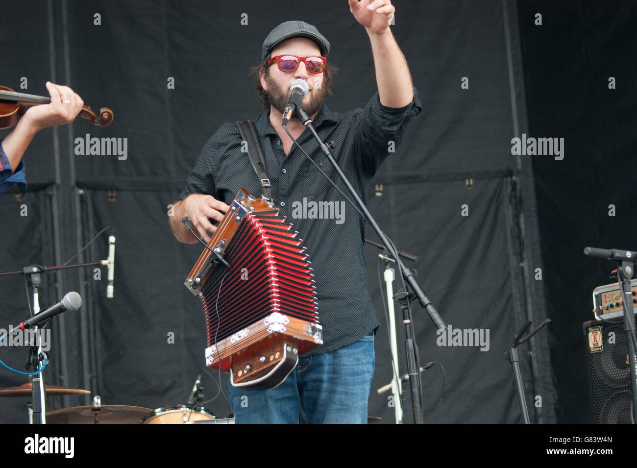Pierre-Luc Dupuis playing a melodeon preforming at the 2015 American Folk Festival as part of the group De Temps Antan Stock Photo