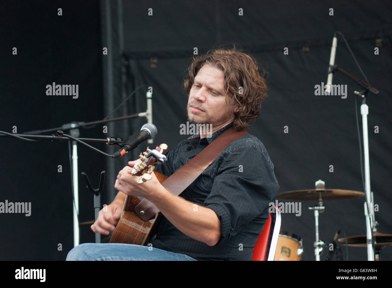 Eric Beaudry, Quebecois musician playing the guitar for De Temps Antan performing at the 2015 American Folk Festival, Bangor, ME Stock Photo