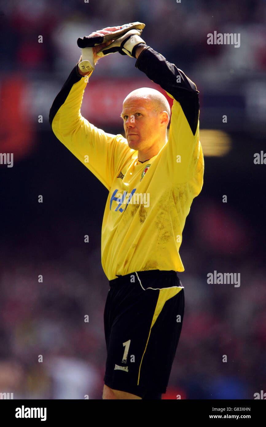 Blackburn Rovers goalkeeper Brad Friedel applauds the travelling