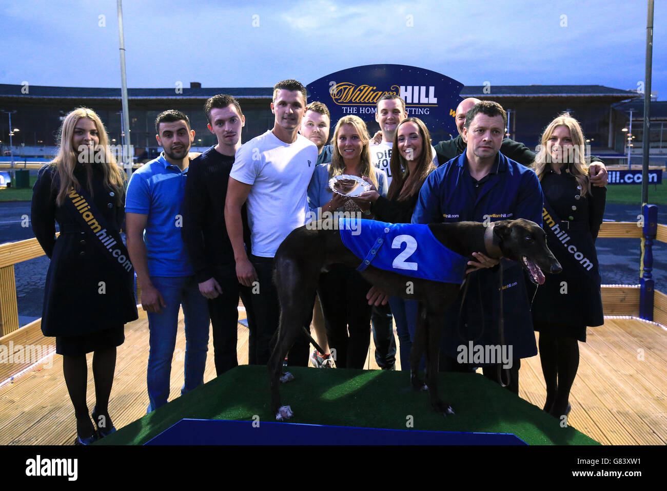 Greyhound Racing - William Hill Derby - Semi Finals - Wimbledon Stadium. Connections of Priceless Sun during the presentation for the William Hill Champion Hurdle Heat 2 Stock Photo