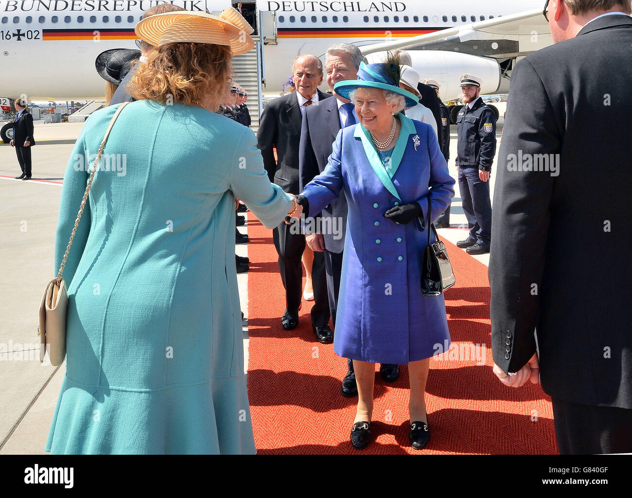 Queen Elizabeth II, the Duke of Edinburgh and German President Joachim Gauck arrive at Frankfurt am Main International Airport, on the second day of a four day State visit by the Queen, to Germany. Stock Photo