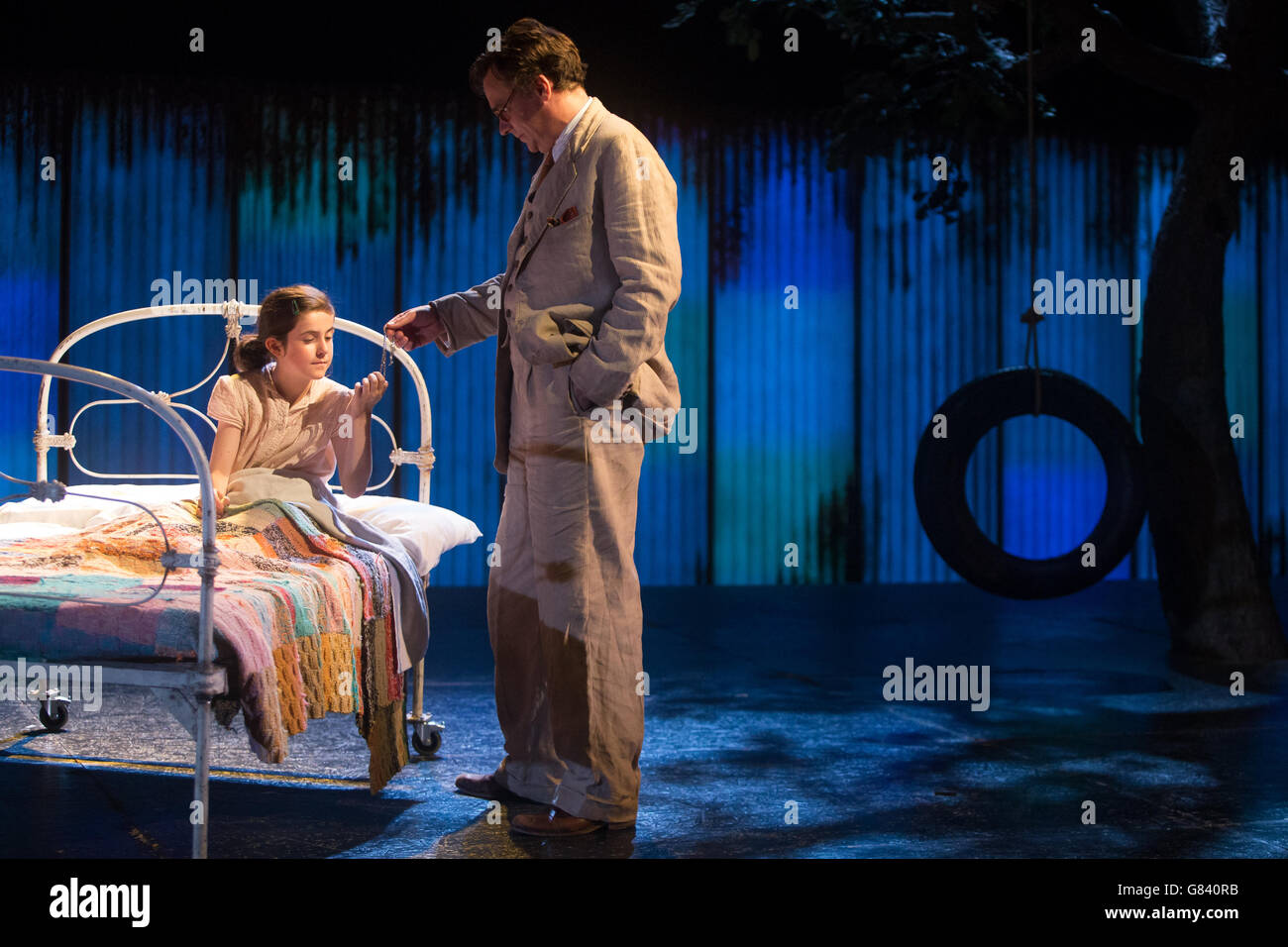 Production photo call for To Kill a Mockingbird. Robert Sean (R) as Atticus Finch and Ava Potter as Scout play their roles in a photo call for the 'To Kill a Mockingbird. The play runs from 24 June until 25 July 2015 at the Barbican. Barbican Theatre, London. 25th June 2015. Daniel Leal-Olivas/PA Showbiz Stock Photo