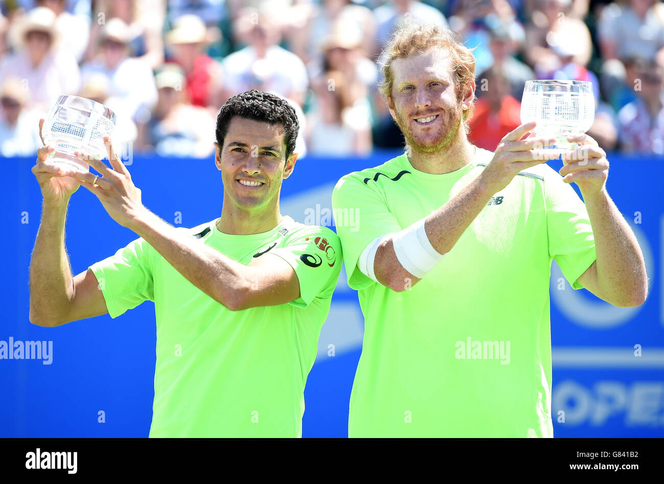 Andre Sa (left) and Chris Guccione celebrate with their trophies after winning the Doubles Final at the AEGON Open Nottingham. Stock Photo