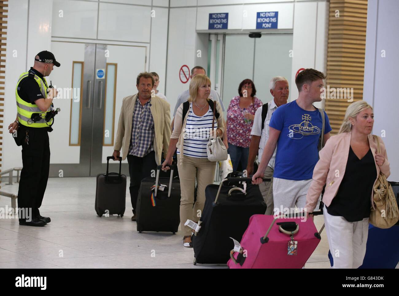 Passengers arrived back at Glasgow Airport after returning on a flight from Tunisia. Stock Photo