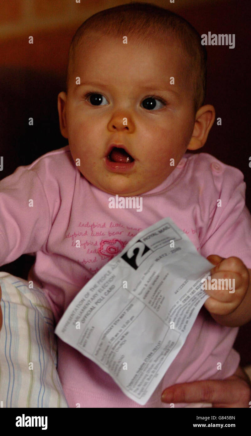 Eight-month-old Kiera Spear from Haverhill, Cambridgeshire, holds her chewed Poll Card for next month's General Election, that mother Glenda Spear received through the post for her daughter to vote with on May 5th. Mrs Spear added: 'She watches television but she hasn't shown any interest in Mr Blair or Mr Howard or Mr Kennedy. She quite likes Thomas the Tank Engine.' Stock Photo