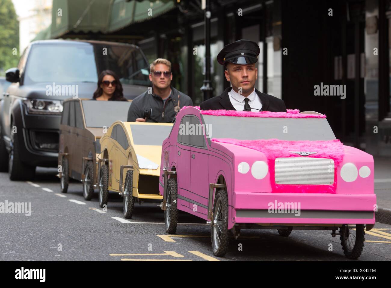 EDITORIAL USE ONLY Soapbox versions of a Range Rover, Bentley and ...