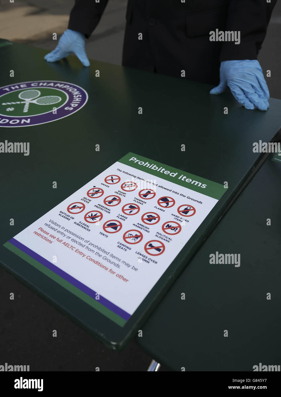 A security sign at the baggage check table at the entrance to the