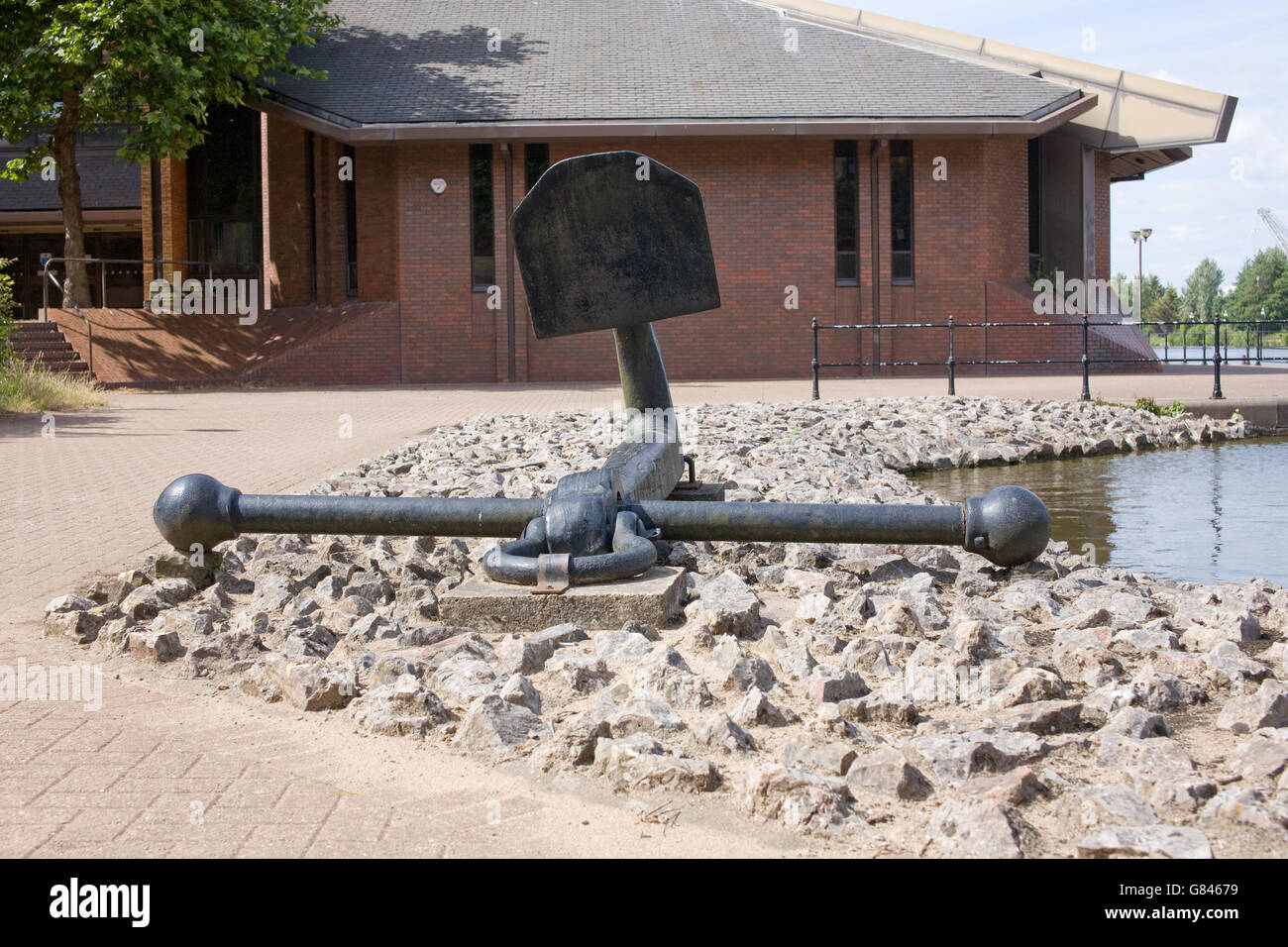 An anchor from an ocean going ship in Atlantic Wharf, Cardiff, a reminder of the city's industrial and maritime past. Stock Photo