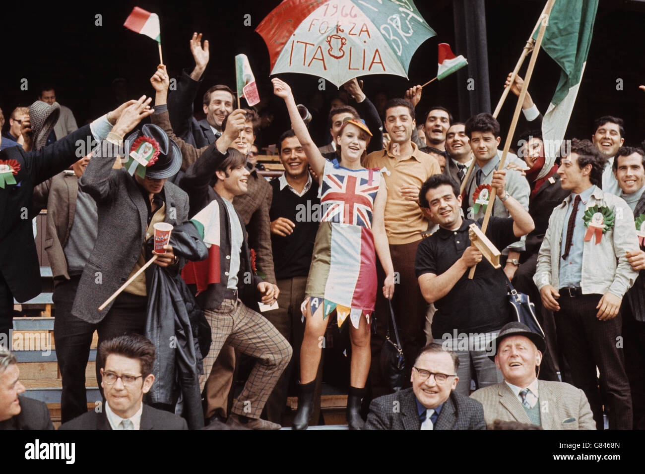 17 year old Kathleen Riddel of Sunderland cheers on Italy with the help of some native Italian fans. Stock Photo