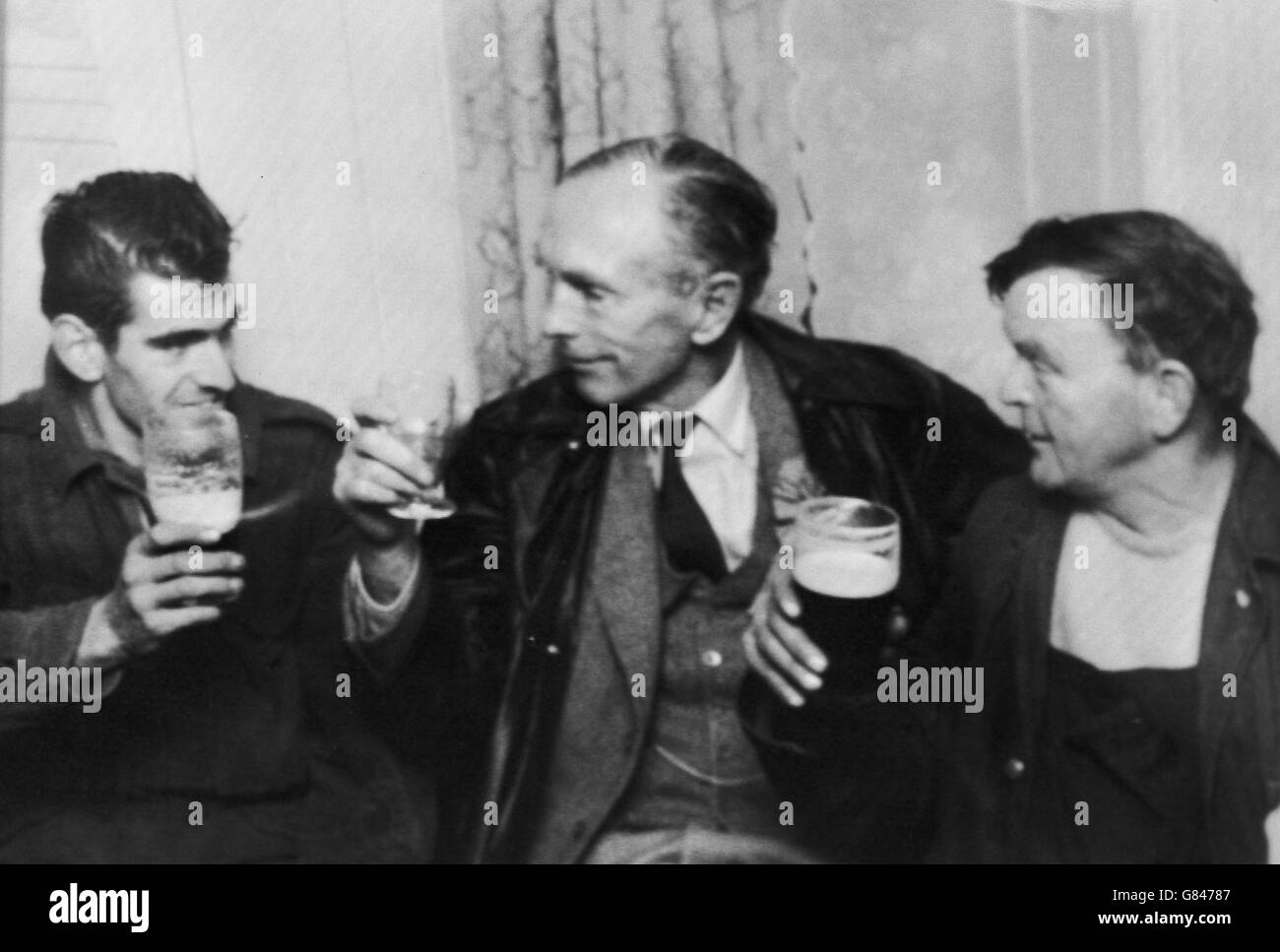 Prime Minister Sir Alec Douglas-Home talks to farm workers Willie Copeland (right) and Tom Smith during a visit to the Muthill Arms in the village of Muthill, Perthshire. He is campaigning in the Kinross and West Perthshire by-election. Stock Photo