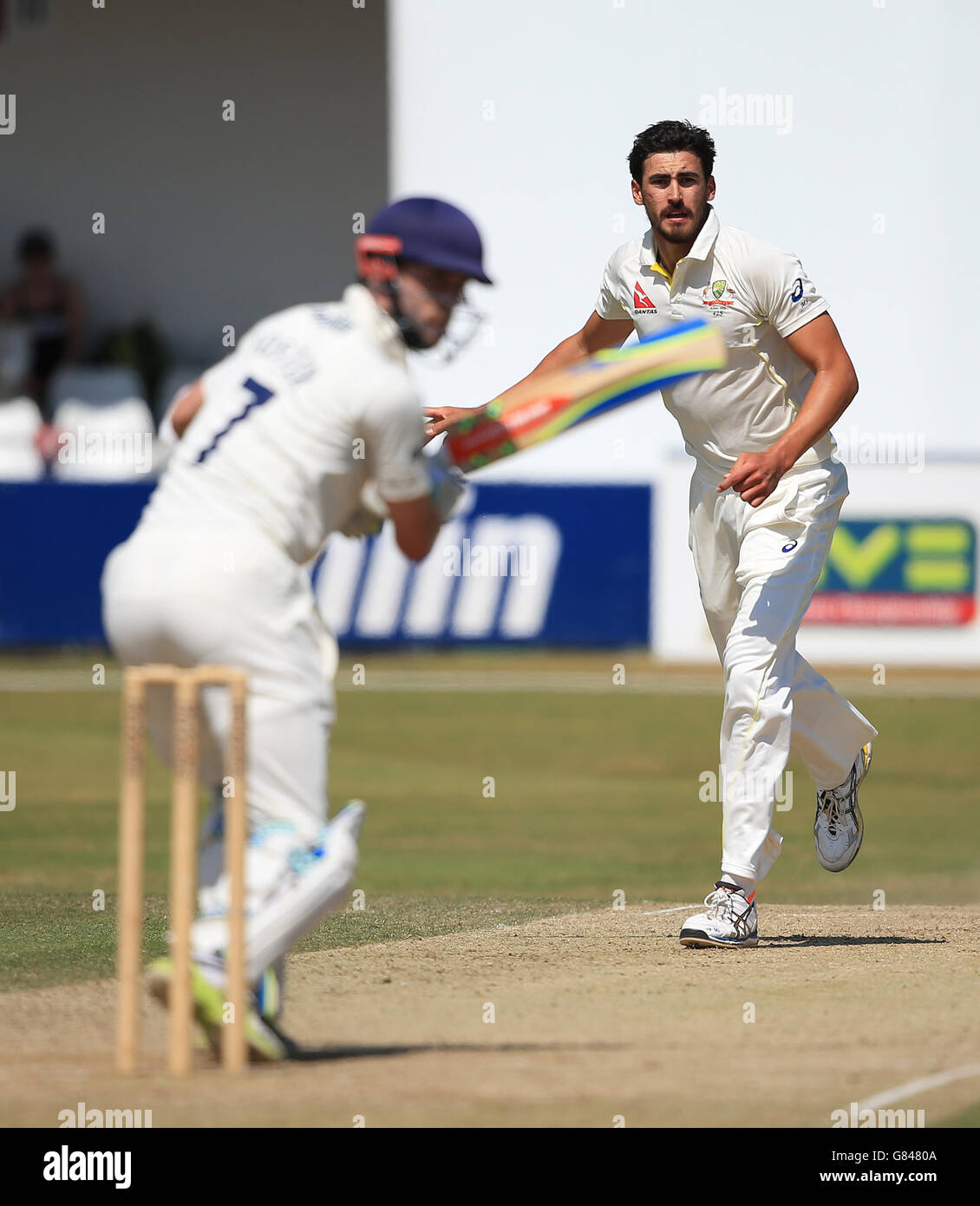 Australia's Mitchell Starc takes the wicket of Essex batsman James Foster caught by Michael Clarke in the slips during the tour match at the Essex County Ground, Chelmsford. Stock Photo