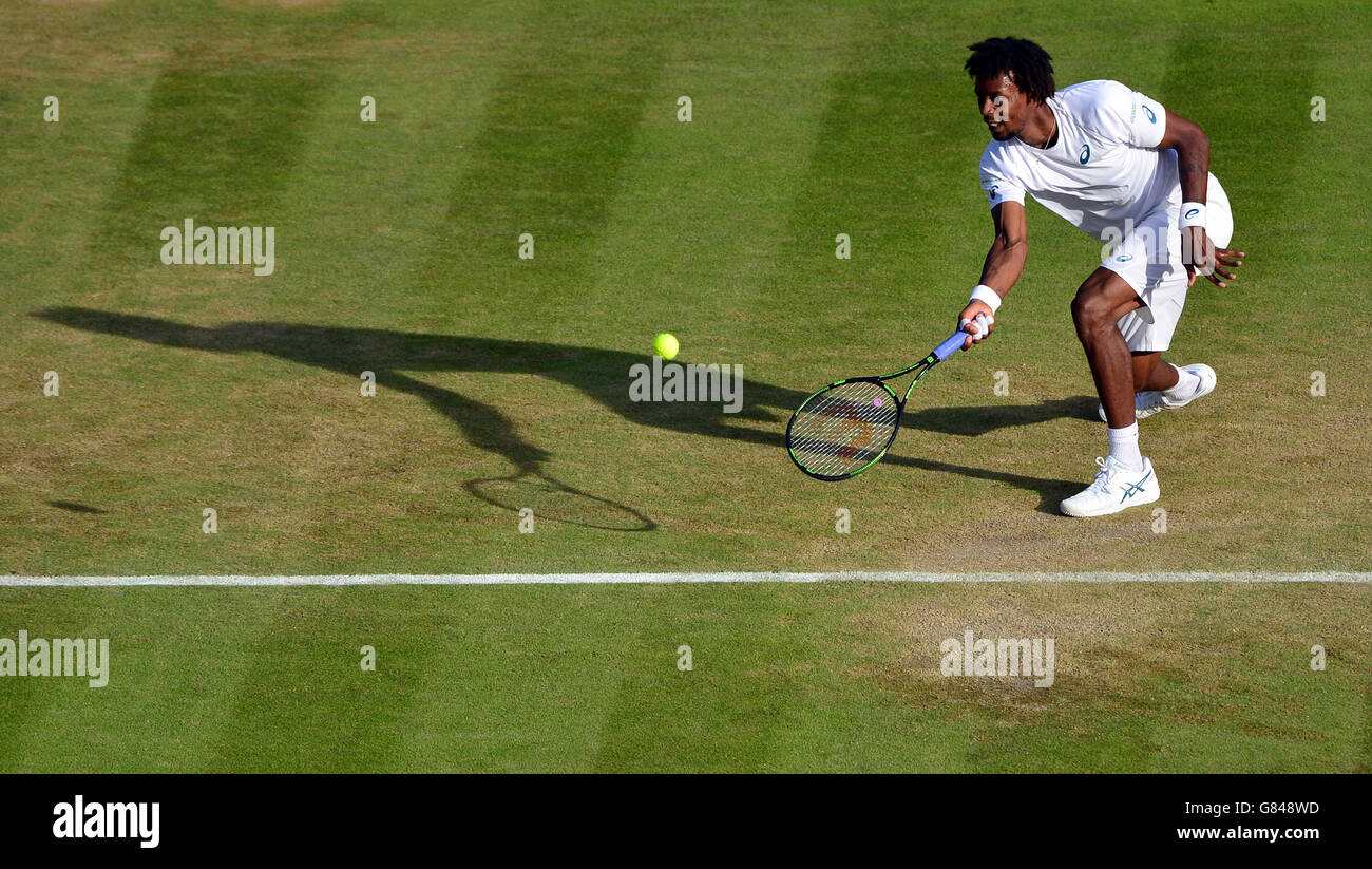 Gael Monfils in action against Gilles Simon during day Six of the Wimbledon Championships at the All England Lawn Tennis and Croquet Club, Wimbledon. Stock Photo