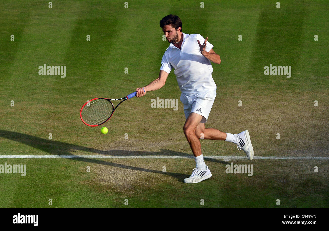 Gilles Simon in action against Gael Monfils during day Six of the Wimbledon Championships at the All England Lawn Tennis and Croquet Club, Wimbledon. Stock Photo