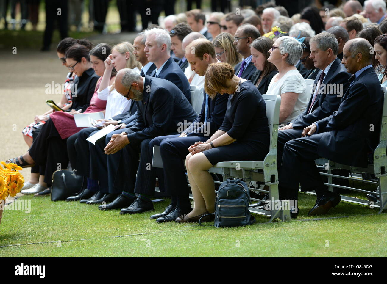 The Duke of Cambridge (second right) sits with Gerald Oppenheim, who was chairman of the London Bombing Relief Charitable Fund (third right) and Labour MP Tessa Jowell, during the July 7 memorial in Hyde Park, London, as Britain remembers the July 7 attacks amid a welter of warnings about the enduring and changing threat from terrorism a decade on. Stock Photo