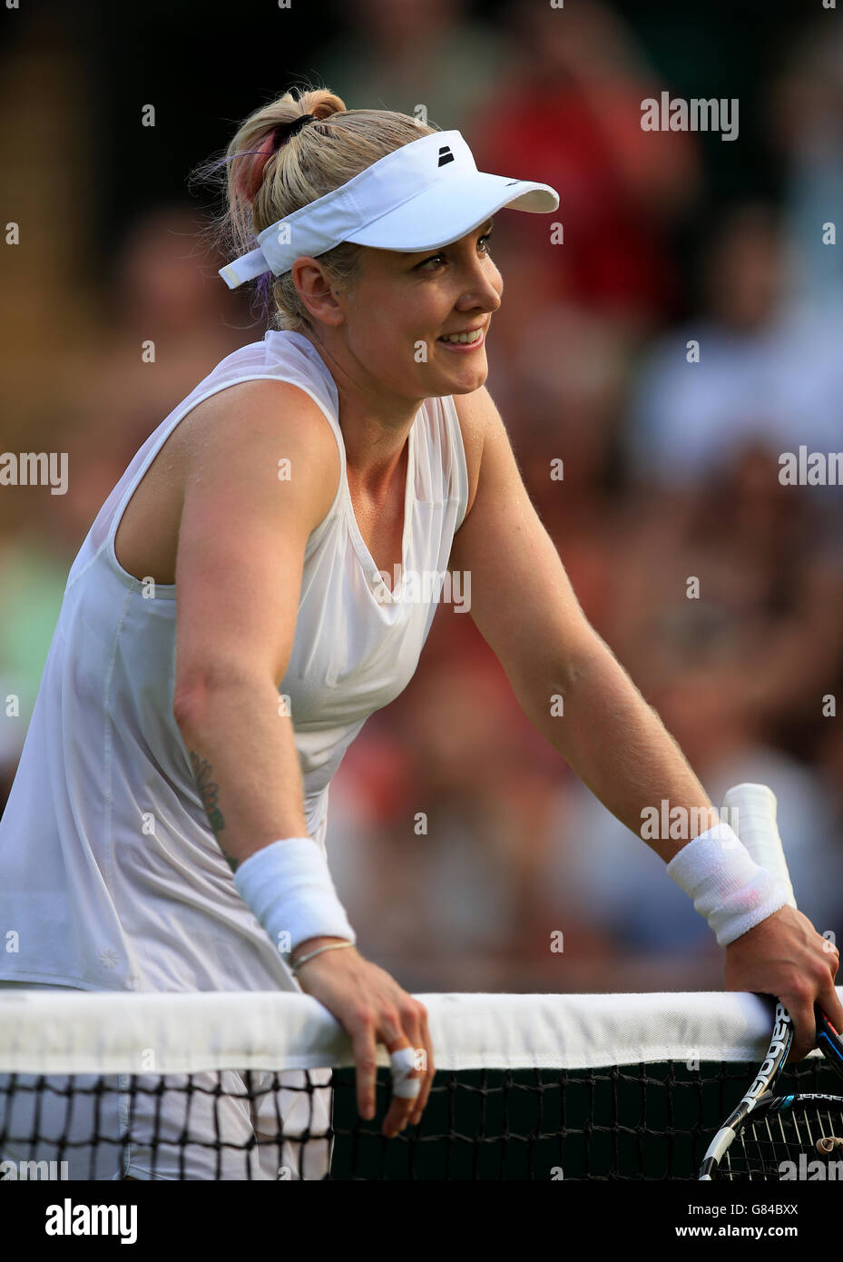 Bethanie Mattek-Sands celebrates against Ana Ivanovic on day Three of the Wimbledon Championships at the All England Lawn Tennis and Croquet Club, Wimbledon. Stock Photo