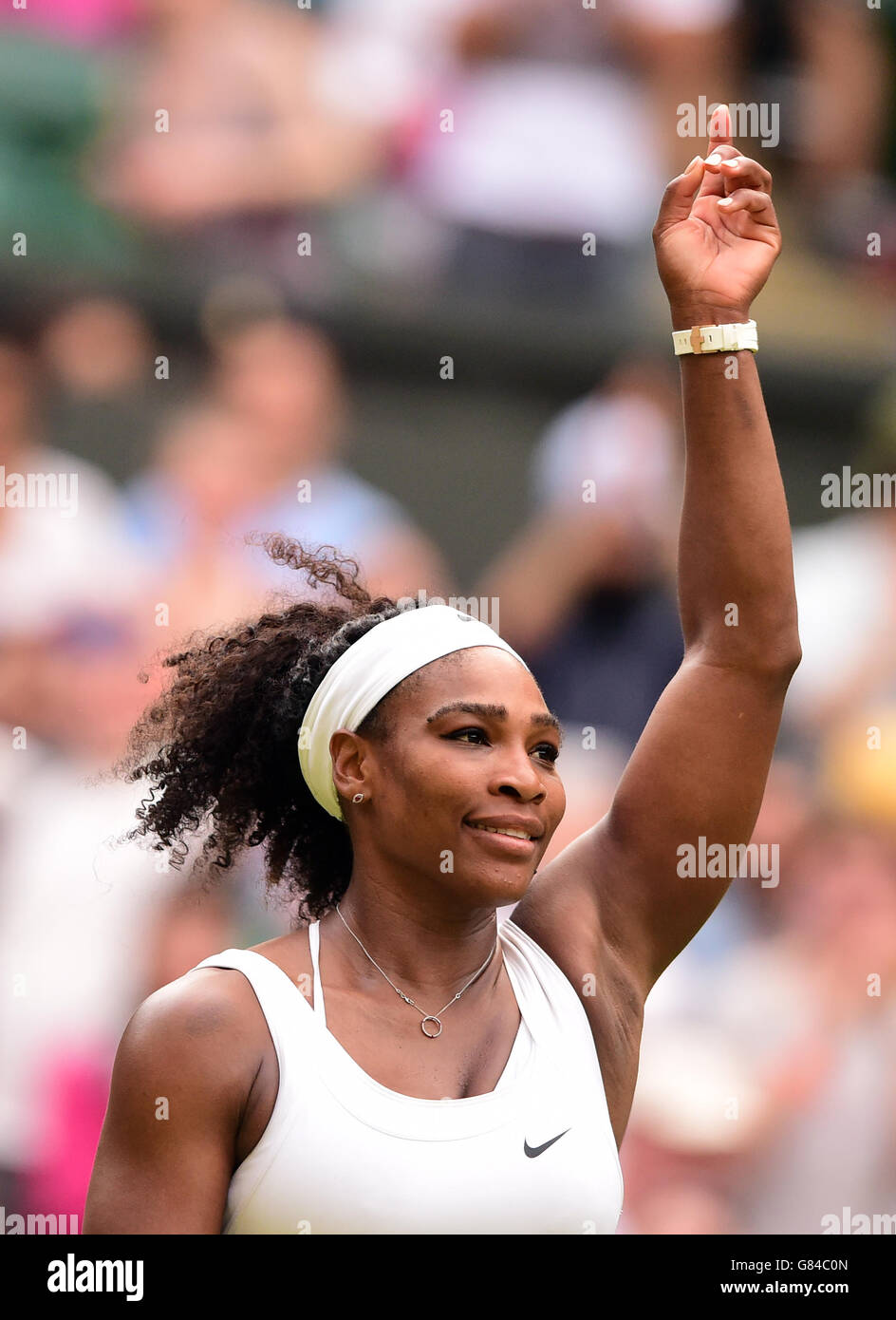 Serena Williams celebrates victory over Timea Babos during day Three of the Wimbledon Championships at the All England Lawn Tennis and Croquet Club, Wimbledon. Stock Photo