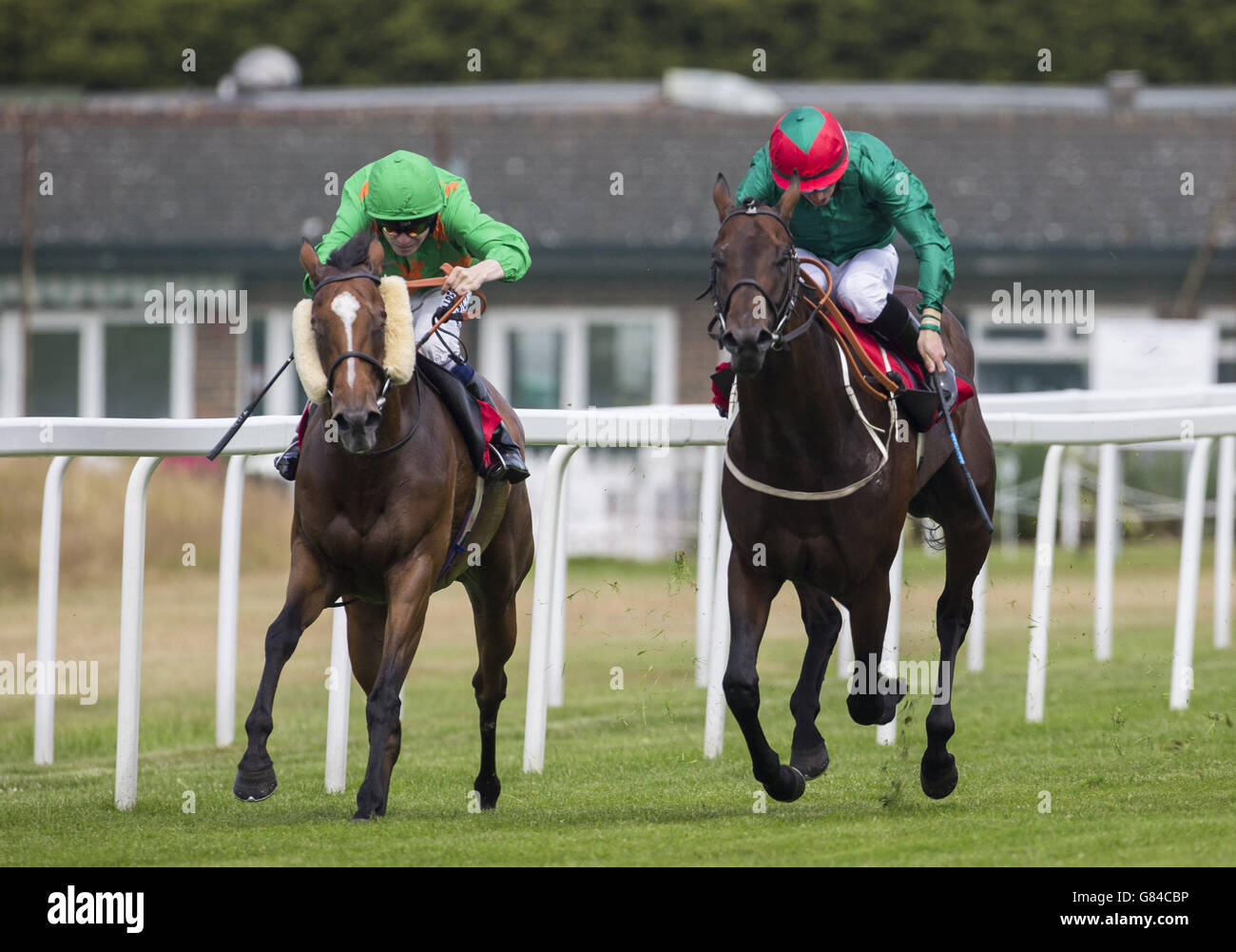 Midlander ridden by Andrew Elliott (right) gets the better of Sleepy
