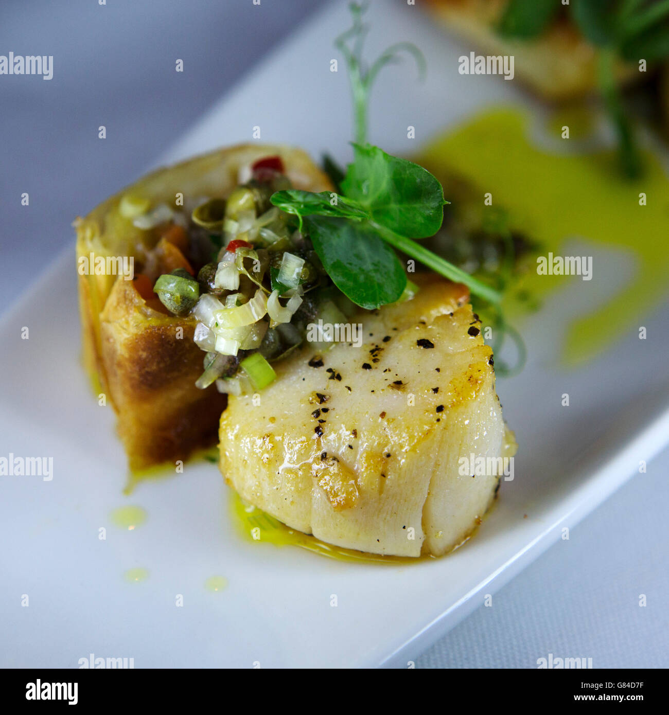 Scallop and seasonal vegetables served in Northumberland, England. Stock Photo