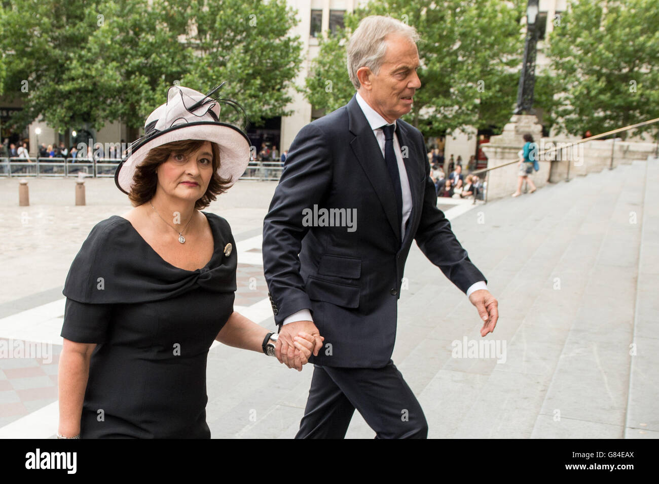Former prime minister Tony Blair and wife Cherie arrive for a memorial