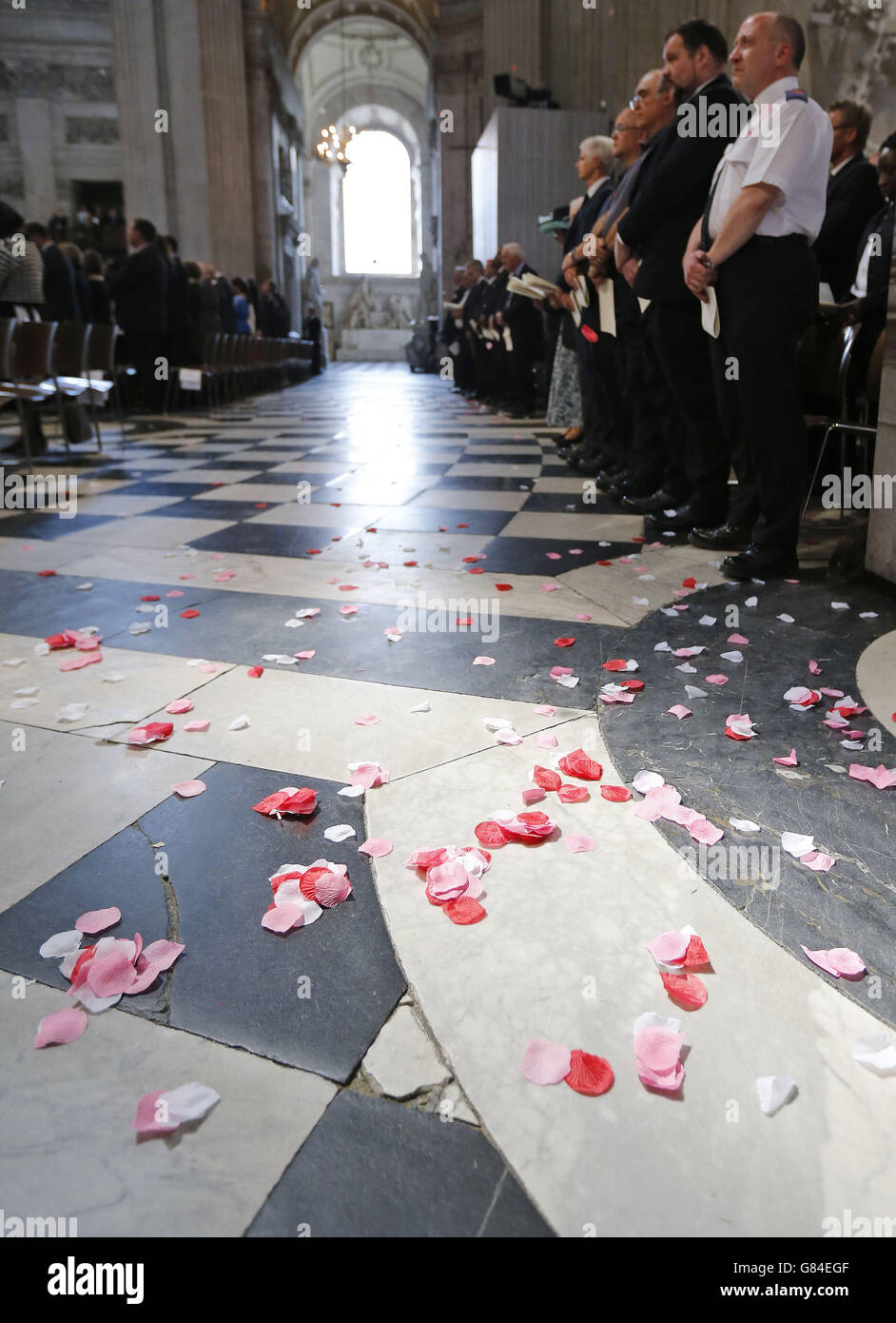 Poppy petals are symbolically scattered on the floor during a service in St Paul's Cathedral, to commemorate the tenth anniversary of the London Bombings in London. Stock Photo