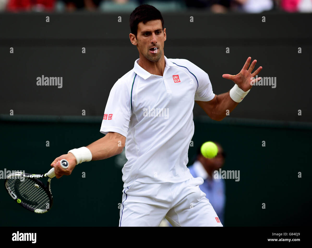 Novak Djokovic in action against Kevin Anderson during day Eight of the Wimbledon Championships at the All England Lawn Tennis and Croquet Club, Wimbledon. Stock Photo