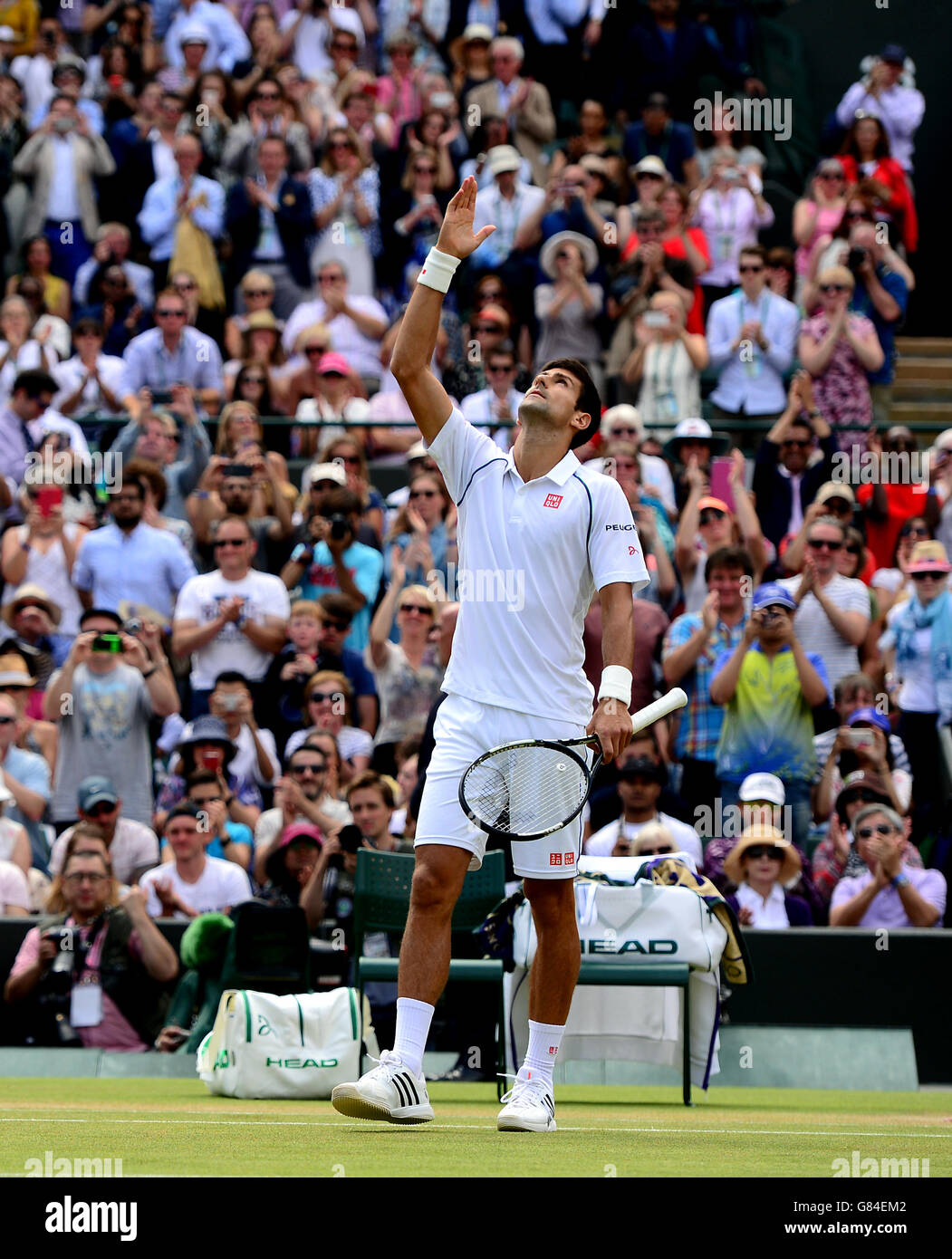 Novak Djokovic celebrates victory over Kevin Anderson during day Eight of the Wimbledon Championships at the All England Lawn Tennis and Croquet Club, Wimbledon. Stock Photo