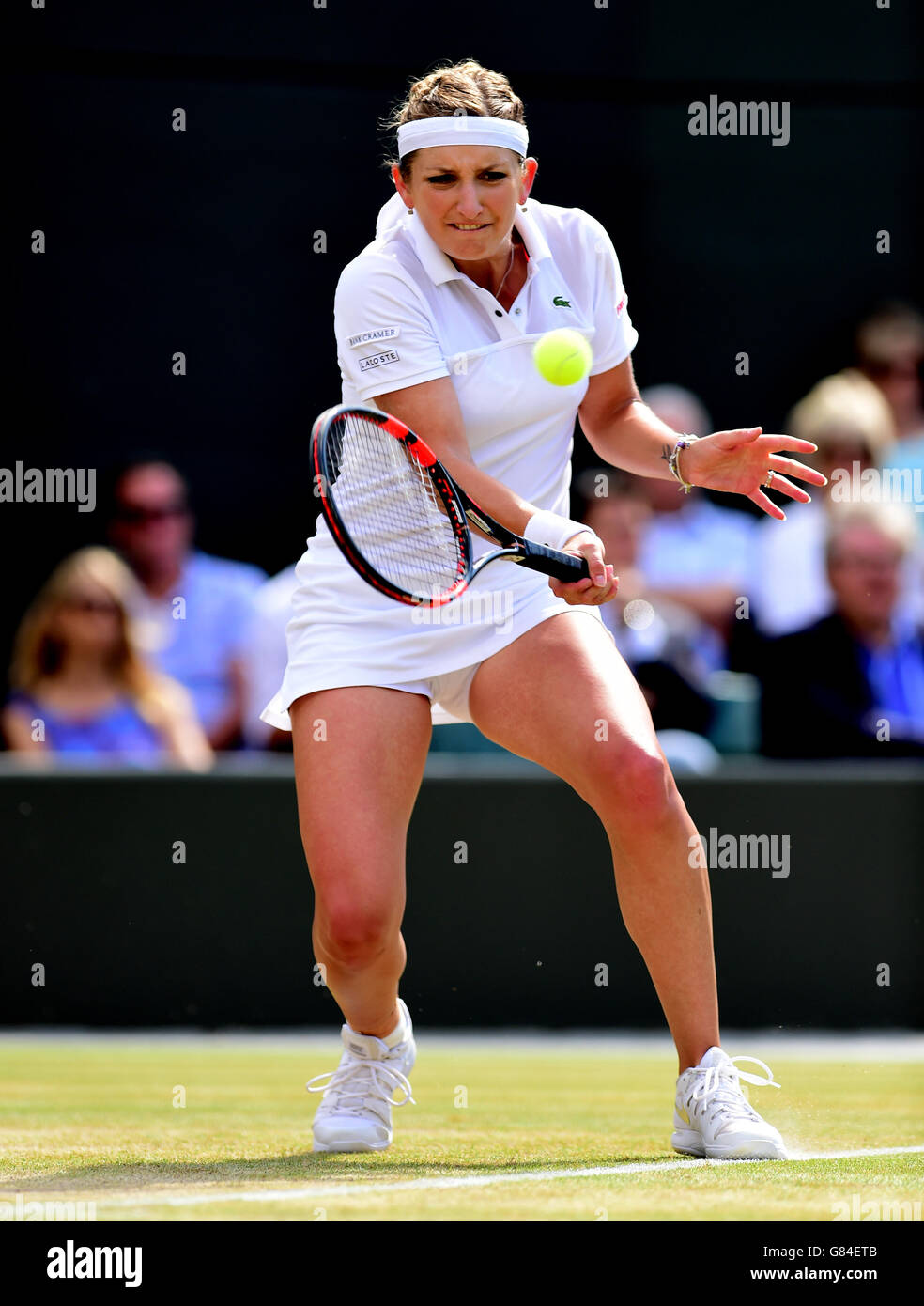 Timea Bacsinszky in action against Gabine Muguruza during day Eight of the Wimbledon Championships at the All England Lawn Tennis and Croquet Club, Wimbledon. Stock Photo