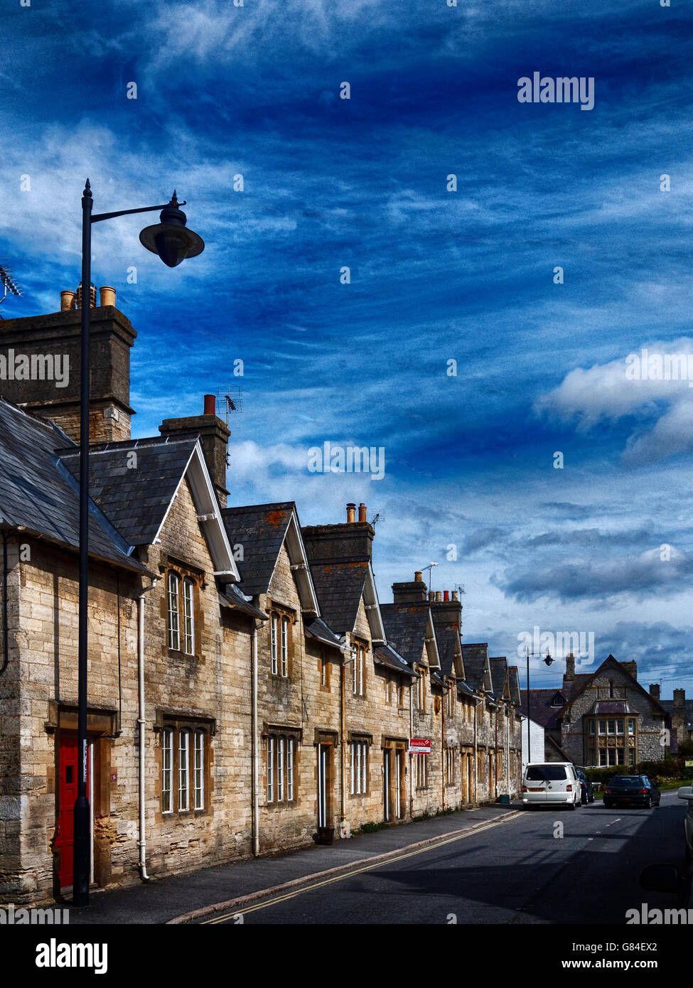 A row of terraced cottages on High Street, Puddletown, Dorset, a village that inspired Thomas Hardy's novels. Stock Photo