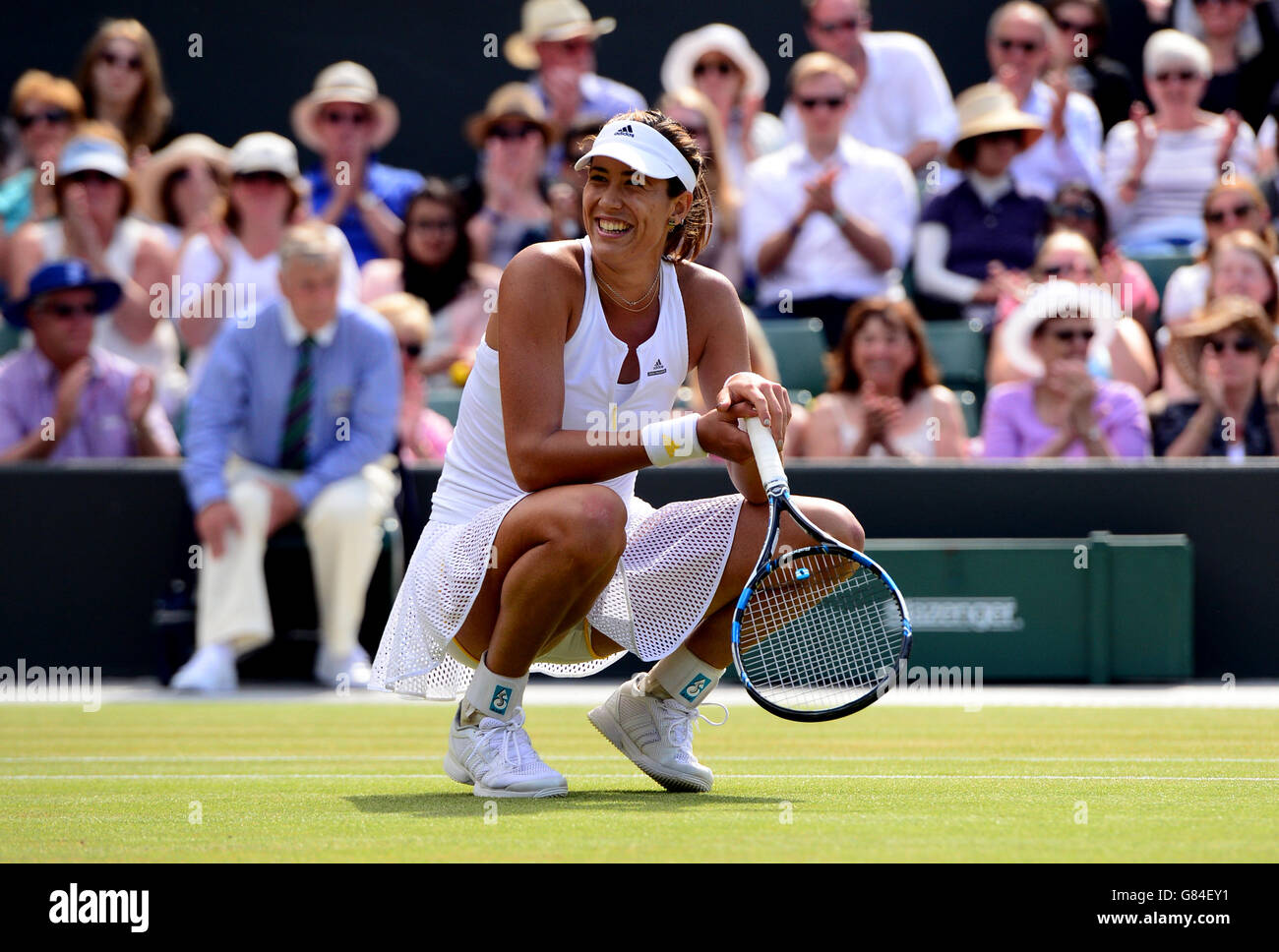 Gabine Muguruza celebrates victory over Timea Bacsinszky during day Eight of the Wimbledon Championships at the All England Lawn Tennis and Croquet Club, Wimbledon. Stock Photo