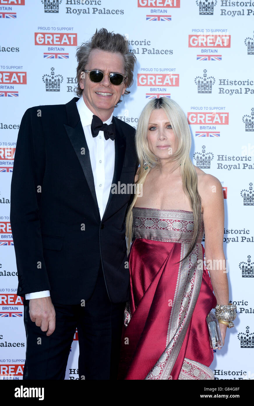 John Taylor and Gela Nash-Taylor attend the Kensington Palace Summer Gala to raise funds for the care of the Royal Ceremonial Dress Collection, London. Stock Photo