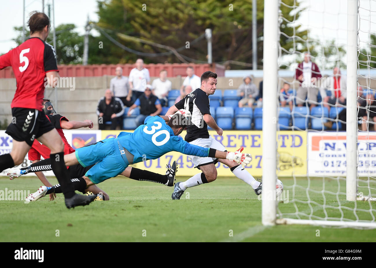 Bala Town's Ian Sheridan scores his teams second goal past FC Differdange  03's goal keeper Arnaud Schaab during the Europa League First Qualifying  Round, Second Leg, at Belle Vue Stadium, Rhyl Stock