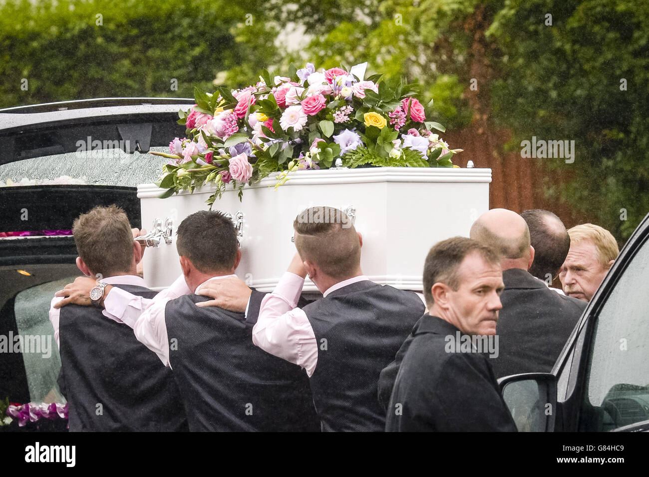 The White Coffin Of Trudy Jones, 51, Is Carried By Pallbearers At St 