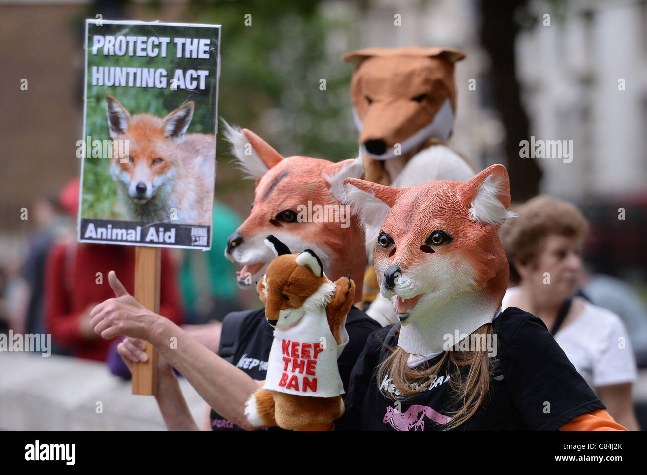 People wearing fox masks join a wildlife protection protest, organised by the Badger Trust, outside 10 Downing Street, London. Stock Photo