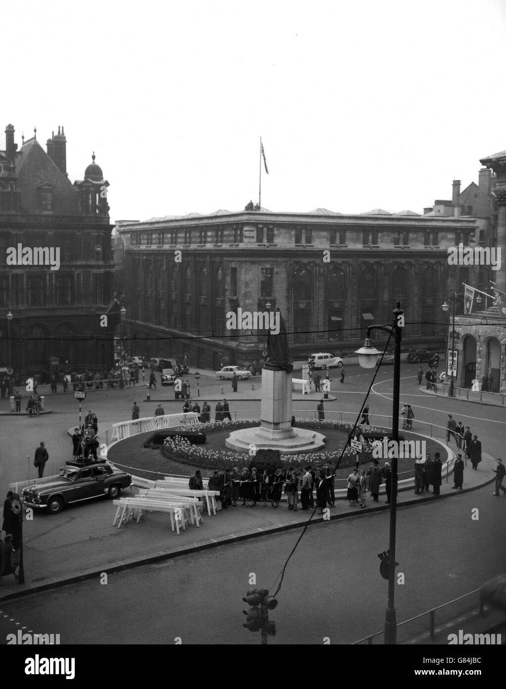 Security men are perched on the roof overlooking the almost empty square by the Council House during a visit by Soviet leaders Marshal Bulganin and Nikita Krushchev to Birmingham. Stock Photo