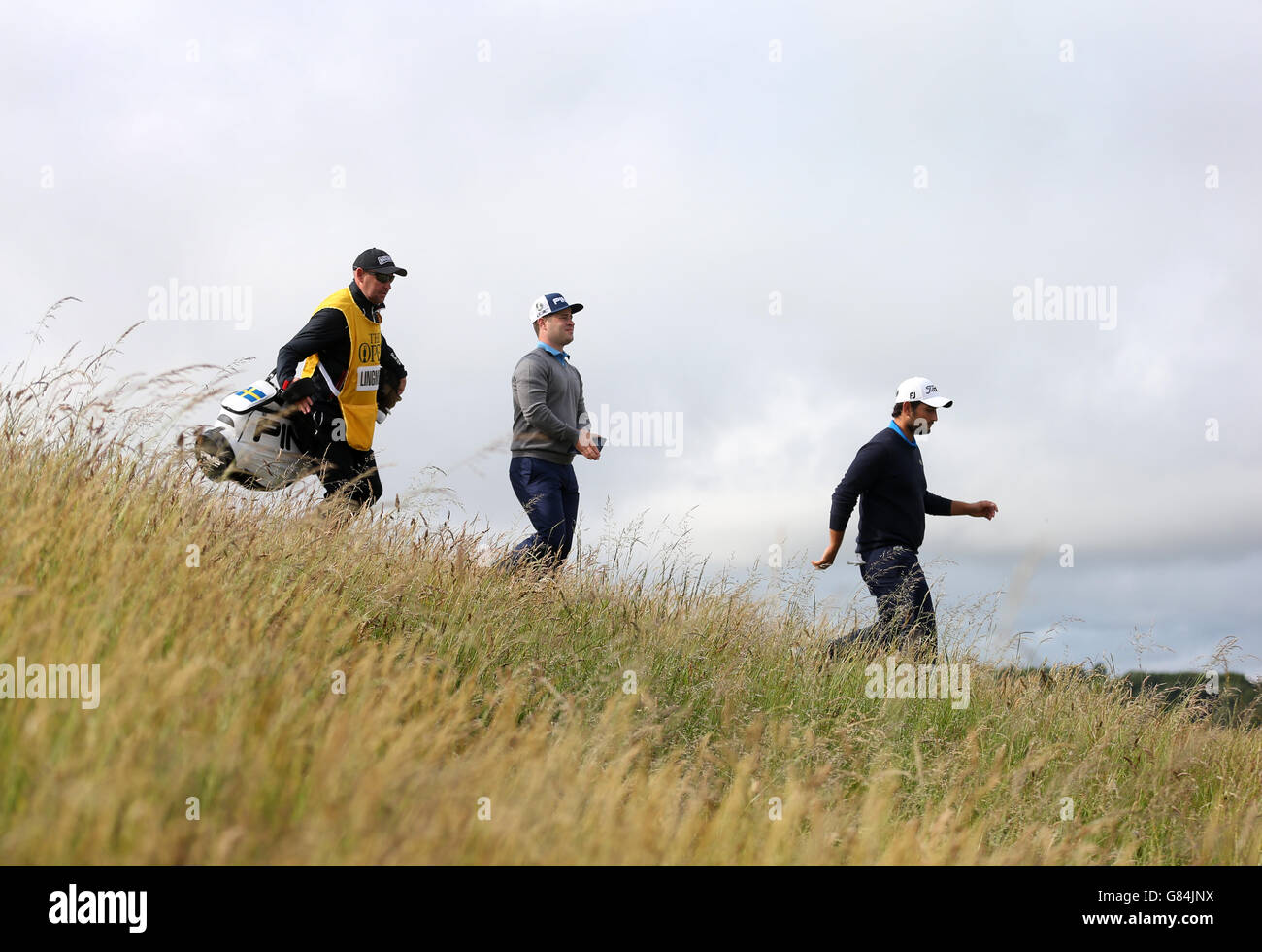 Sweden's David Lingmerth follows France's Alexander Levy off the 6th tee during day one of The Open Championship 2015 at St Andrews, Fife. Stock Photo