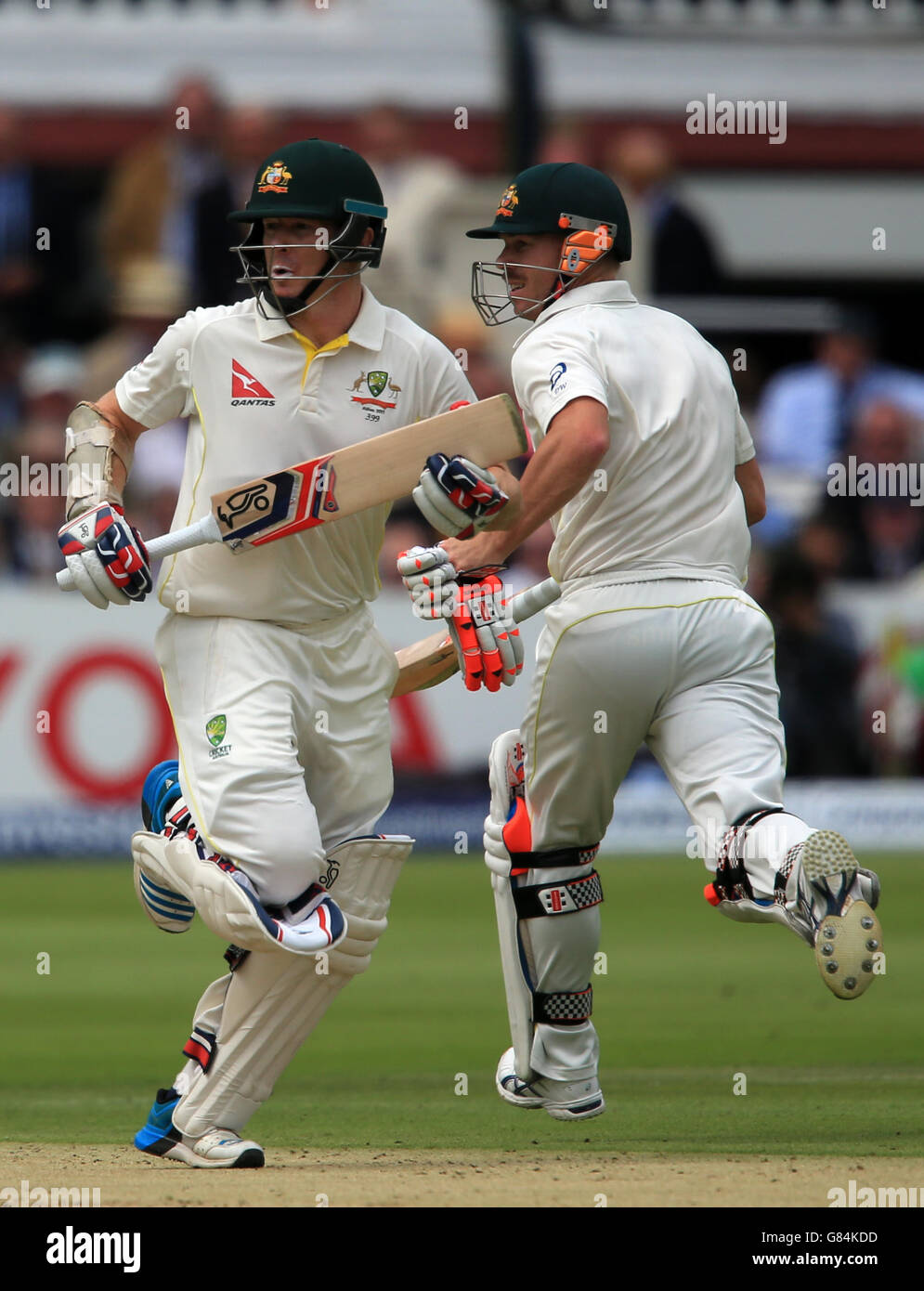 Australia's Chris Rogers (left) and David Warner score runs during the Second Investec Ashes Test at Lord's, London. Stock Photo