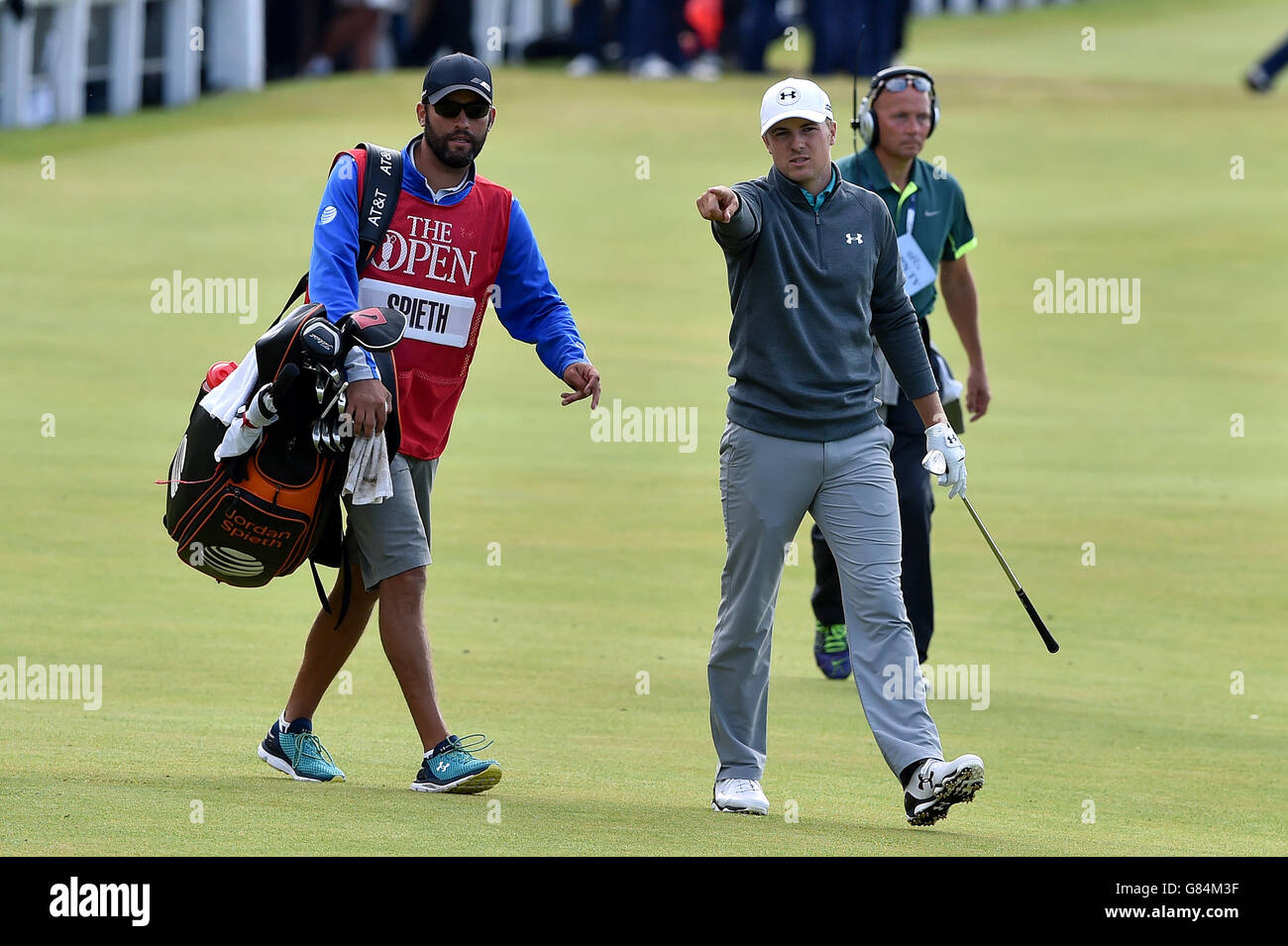 USA's Jordan Spieth in conversation with his caddie as he walks his way up to the 18th during