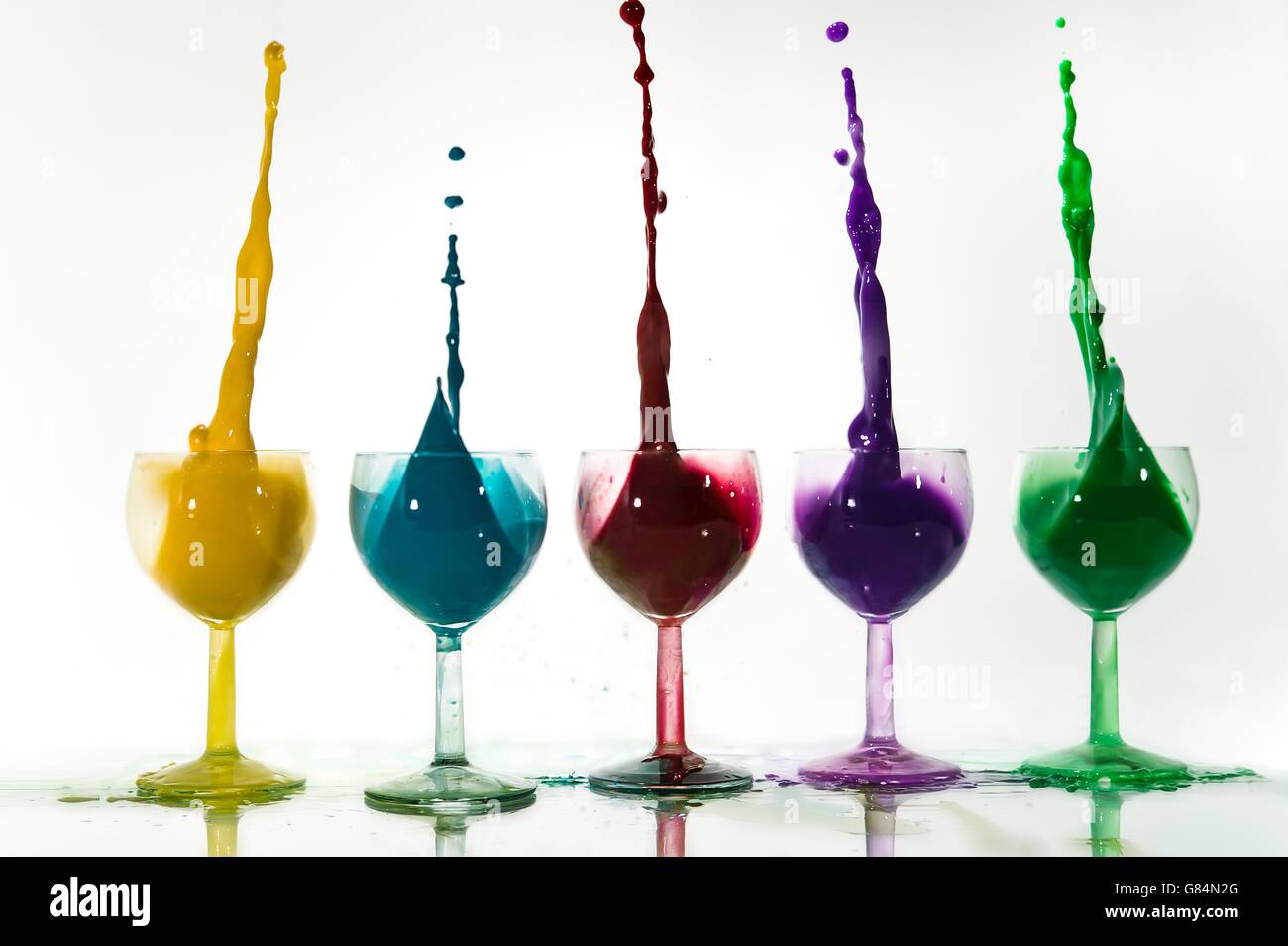 Five wine glasses with acrylic paint splashes Stock Photo Alamy