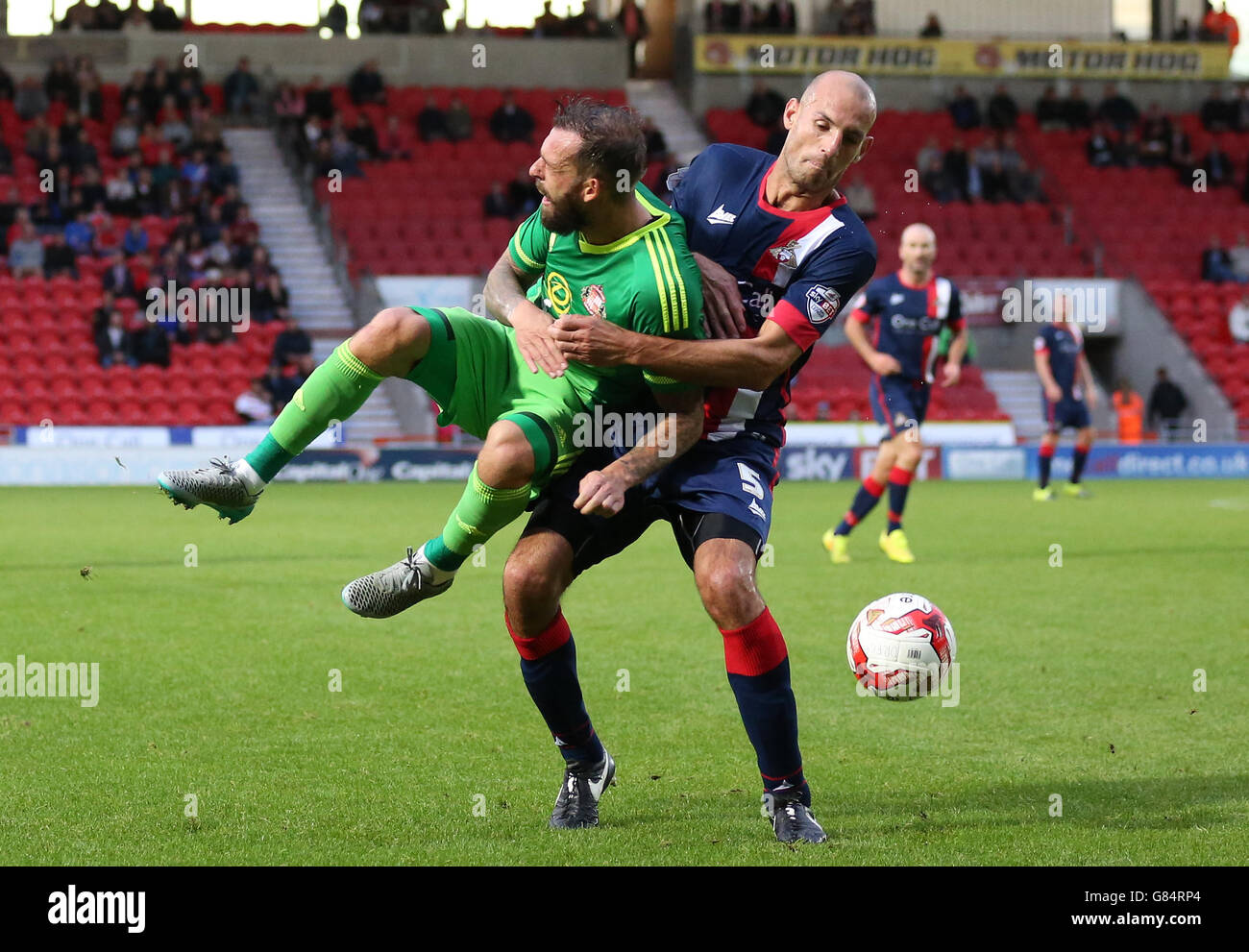Sunderland's Steven Fletcher (left) and Doncaster Rovers' Rob Jones battle for the ball during the Pre-Season Friendly match at the Keepmoat Stadium, Doncaster. Stock Photo