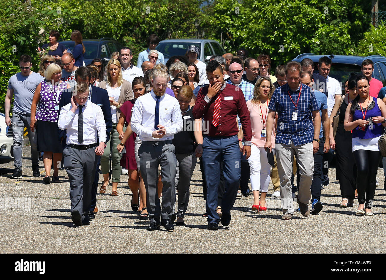 Staff members of the holiday company TUI return to their offices in Crawley, West Sussex, after observing a minutes silence for the victims of the Tunisia attack. Stock Photo