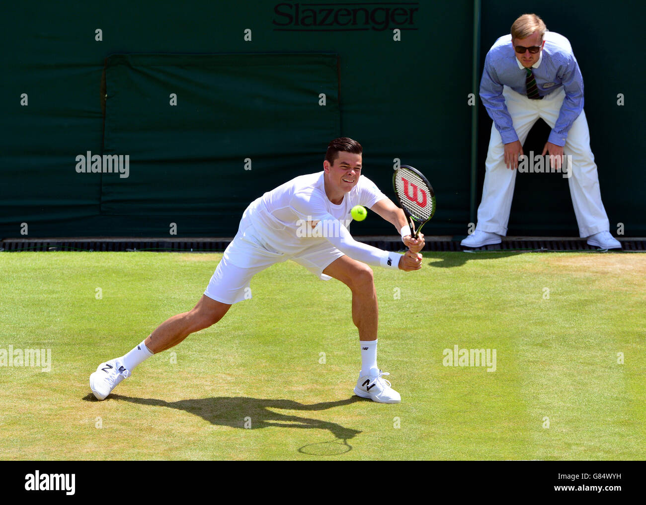 Milos Raonic in action against Nick Kyrgios during day Five of the Wimbledon Championships at the All England Lawn Tennis and Croquet Club, Wimbledon. Stock Photo