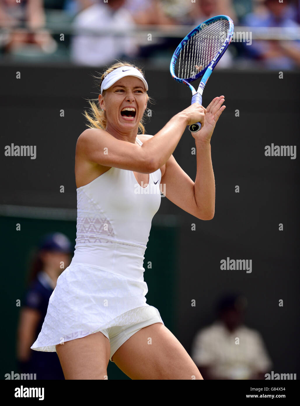 Maria Sharapova in action against Zarina Diyas during day Seven of the Wimbledon Championships at the All England Lawn Tennis and Croquet Club, Wimbledon. Stock Photo