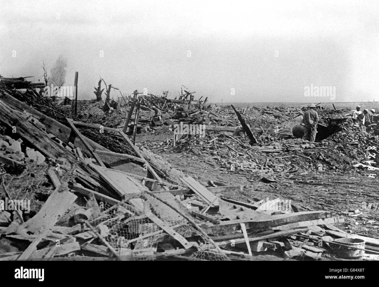 French troops scour the wreckage of a farm at Monacu near Maurepas Stock Photo