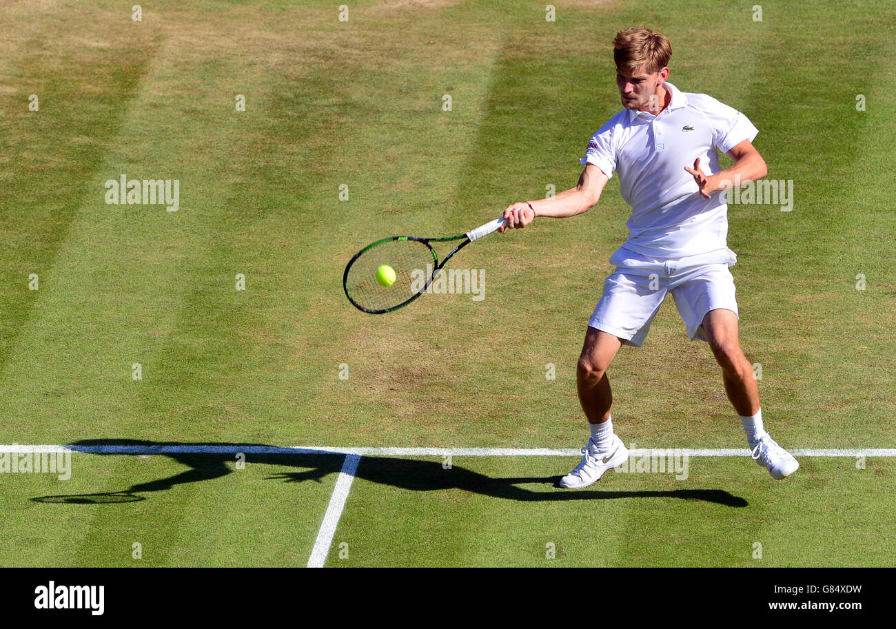 David Goffin in action against Stan Wawrinka during day Seven of the Wimbledon Championships at the All England Lawn Tennis and Croquet Club, Wimbledon. Stock Photo