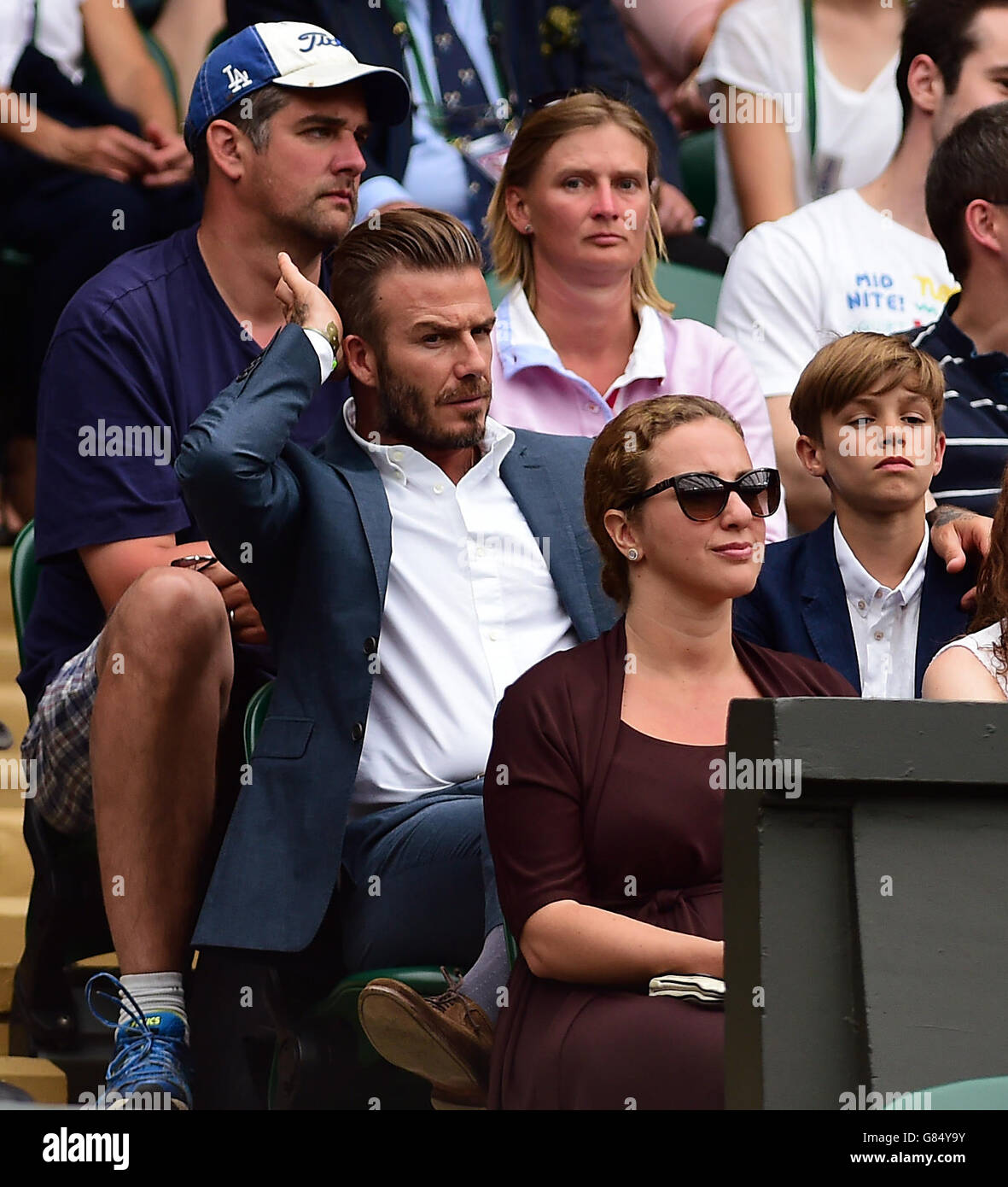 David Beckham and his son Romeo during day Nine of the Wimbledon Championships at the All England Lawn Tennis and Croquet Club, Wimbledon. Stock Photo