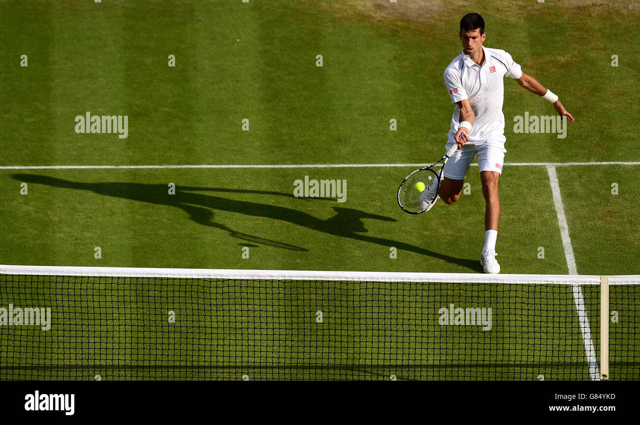 Novak Djokovic in action against Marin Cilic on day Nine of the Wimbledon Championships at the All England Lawn Tennis and Croquet Club, Wimbledon. Stock Photo